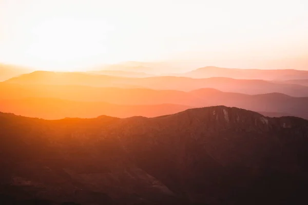 Horizontal view of beautiful layers of mountains with golden light at sunset in Las Villuercas, Caceres, Extremadura, Spain