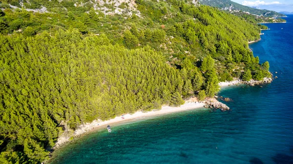 Croatia. Aerial view on beach and people. Vacation and relax. Beach and blue water. Top view from drone at beach and azure sea. Travel and holiday