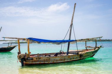 travelling Africa Kenya and Zanzibar seascape with crystal clear turquoise water and traditional sail boat landscape from Diani Beach and Watamu. Kendwa tour with wooden catamaran