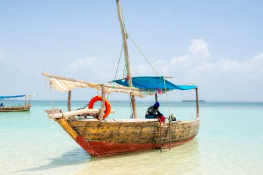 Dhow Fishing Boat at low tide on Zanzibar island, Tanzania