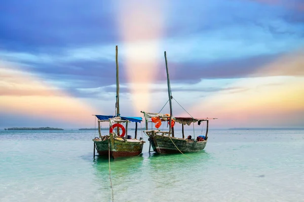 travelling Africa Kenya and Zanzibar seascape with crystal clear turquoise water and traditional sail boat landscape from Diani Beach and Watamu. Kendwa tour with wooden catamaran