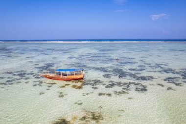 Catamaran (Ngalawa) on amazing turquoise water in the Indian ocean next to Mnemba atoll, Zanzibar, Tanzania