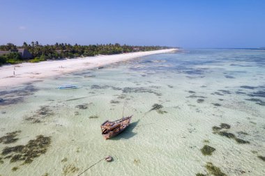 Aerial view of Kiwengwa beach in Zanzibar, Tanzania with luxury resort and turquoise ocean water. Toned image.