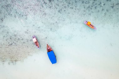 Sailing with a sail boat in Kenya, Zanzibar and in beautiful crystal Turquoise water on white sand tropical beach. Traditional fishing wooden boat in Diani Beach, Watamu and Zanzibar
