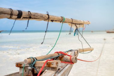 Sailing with a sail boat in Kenya, Zanzibar and in beautiful crystal Turquoise water on white sand tropical beach. Traditional fishing wooden boat in Diani Beach, Watamu and Zanzibar