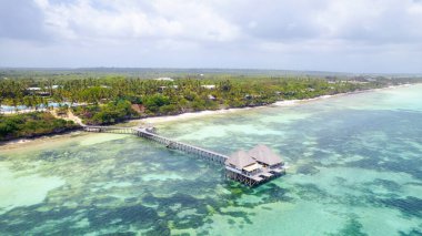 Paradise of Zanzibar - A wooden house on stilts close to the beach in the sea.
