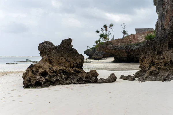 Sunny vacation at Mtende Beach, Zanzibar, surrounded by rocks for a peaceful retreat