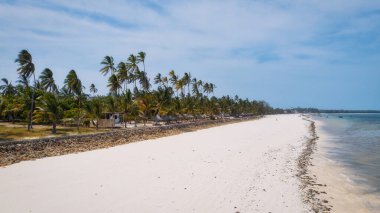 Spend your vacation in Zanzibar's picturesque Nungwi, where you can soak up the sun and admire the local fishing boats dotting the beach.