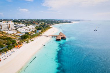 Spend your vacation in Zanzibar's picturesque Nungwi, where you can soak up the sun and admire the local fishing boats dotting the beach.