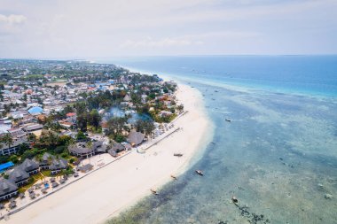 Spend your vacation in Zanzibar's picturesque Nungwi, where you can soak up the sun and admire the local fishing boats dotting the beach.