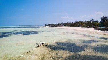 Spend your vacation in Zanzibar's picturesque Nungwi, where you can soak up the sun and admire the local fishing boats dotting the beach.