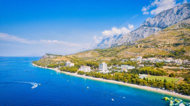 Get lost in the picturesque scene of Croatia's beach, with its stunning turquoise waters and pristine coastline. From above, the aerial view showcases the perfect spot for a vacation and adventure. The drone's-eye view captures the essence of travel