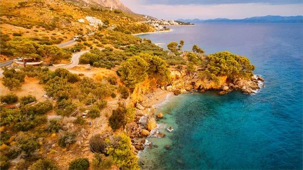 Get lost in the picturesque scene of Croatia\'s beach, with its stunning turquoise waters and pristine coastline. From above, the aerial view showcases the perfect spot for a vacation and adventure. The drone\'s-eye view captures the essence of travel