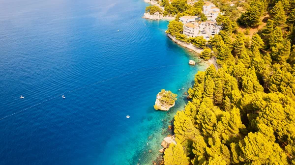 Get lost in the picturesque scene of Croatia\'s beach, with its stunning turquoise waters and pristine coastline. From above, the aerial view showcases the perfect spot for a vacation and adventure. The drone\'s-eye view captures the essence of travel