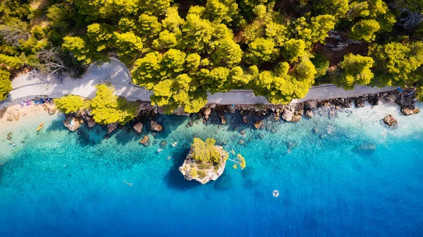 Enjoy the view of Croatia's beach from above, where turquoise waters meet soft sands. Relax and find adventure in this beautiful vacation spot, captured in stunning aerial photography.