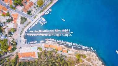 Take in the breathtaking view of Croatia's ports and marinas from above, showcasing luxurious yachts in a stunning drone photo.