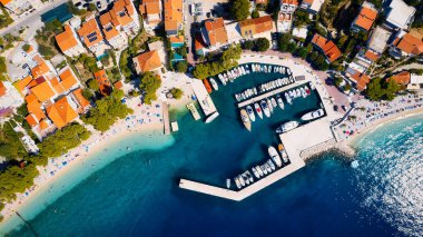 Take in the breathtaking view of Croatia's ports and marinas from above, showcasing luxurious yachts in a stunning drone photo.
