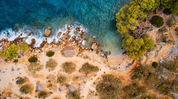 stock image Witness the meeting of the Adriatic Sea and a rugged Croatian rocky slope, where the Pakleni islets and their crystal-clear turquoise waters can be admired from afar.