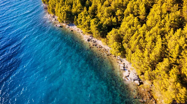 stock image Marvel at the stunning aerial perspective of Croatia's Makarska Riviera, displaying a rocky beach and the captivating turquoise water.