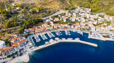 Take in the breathtaking view of Croatia's ports and marinas from above, showcasing luxurious yachts in a stunning drone photo.