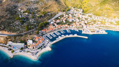 Take in the breathtaking view of Croatia's ports and marinas from above, showcasing luxurious yachts in a stunning drone photo.