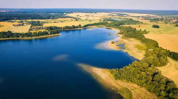 This stunning drone panorama captures a lake in Poland's Lubuskie Voivodeship on a bright and sunny spring day