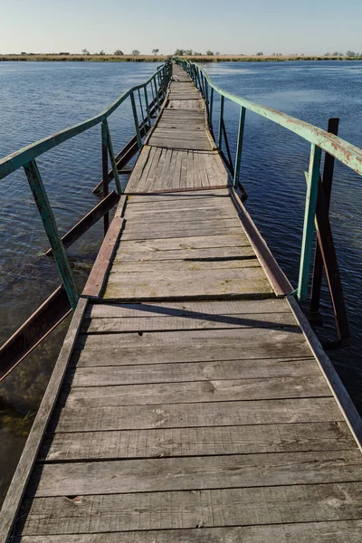 Stock image Bridge connecting river banks landscape photo. Beautiful nature scenery photography with wide channel on background. Idyllic scene. High quality picture for wallpaper, travel blog, magazine, article