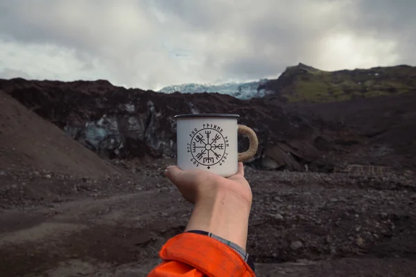 stock image Close up lady holding tourist mug concept photo. Iceland mountains. First person view photography with desert highland on background. High quality picture for wallpaper, travel blog, magazine, article