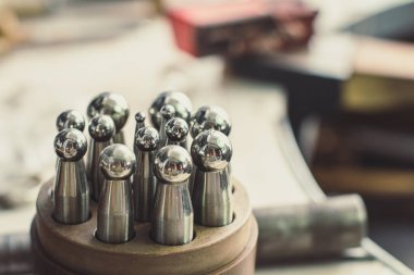 Close up jewelry studio equipment concept photo. Foundry workshop hobby. Front view photography with blurred background. High quality picture for wallpaper, travel blog, magazine, article