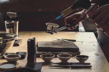 Close up jewellery making course concept photo. Jewelry workshop hobby. Front view photography with blurred background. High quality picture for wallpaper, travel blog, magazine, article