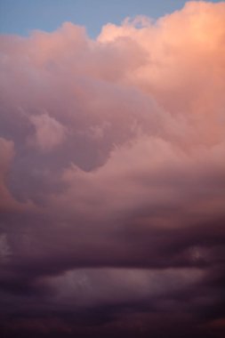 Pink clouds at sunset landscape photo. Beautiful nature scenery photography with sunrise sky on background. Idyllic scene. High quality picture for wallpaper, travel blog, magazine, article