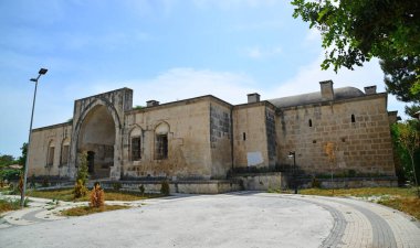 Kurtkulagi Caravanserai and Kurtkulagi Mosque in Adana, Turkey were built in the 17th century during the Ottoman period. Both structures are very close to each other. clipart