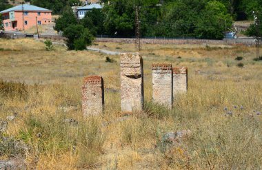 Halime Hatun Vault is a Seljuk mausoleum located in the Gevas district of Turkey. It is located to the east of the Seljuk Cemetery in the district. It was built in 1335 by the Saltuklu chief Meliki Izzettin Saltuk for his daughter Halime Hatun.