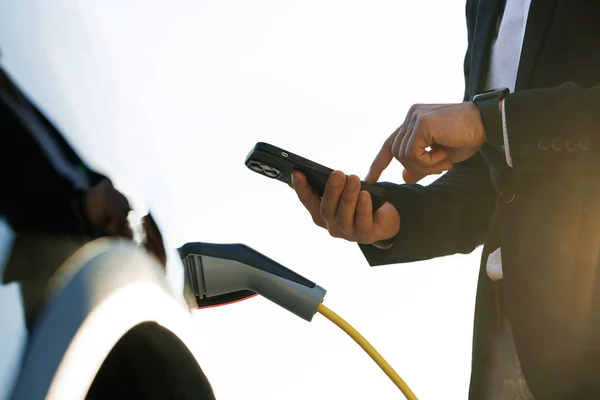 Businessman Charging Electric Car Outdoor Charging Station Unrecognizable Man Plugging — Stockfoto