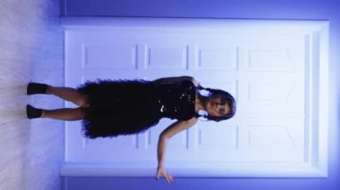VERTICAL VIDEO POV of young girl tiktoker created dancing video by smartphone camera. To share video to social media application. Girl recording trendy dance moves for social media account