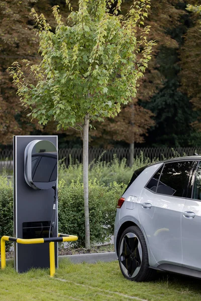 Electric charging station for charging cars. Charge station for electric cars. Electric car charger on street.