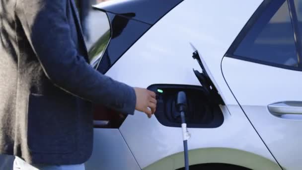 Man Holding Power Supply Cable Electric Vehicle Charging Station Hansome — 图库视频影像