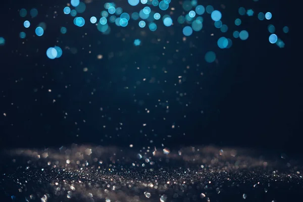 Gloeiend Het Donker Gedefocuste Glitter Textuur Met Blauwe Bokeh Lichten — Stockfoto