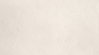 Close-up perspective of a white textured wall, highlighting the subtle patterns and shadows. clipart