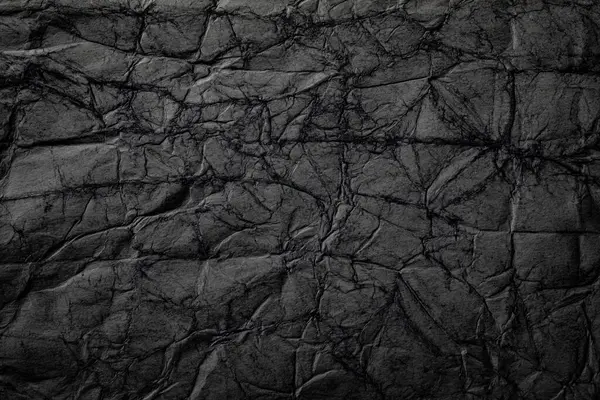 Pürüzlü siyah kağıt dokusu. Kopya alanı için Cadılar Bayramı ve Kara Cuma arkaplanı.