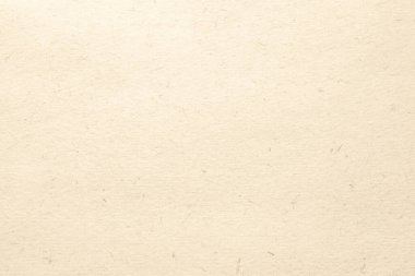 Tasarımcılar ve sanatçılar için çeşitli projelerde kullanılacak nötr bir arkaplan sağlayan bej desenli bir kağıdın net bir görüntüsü.