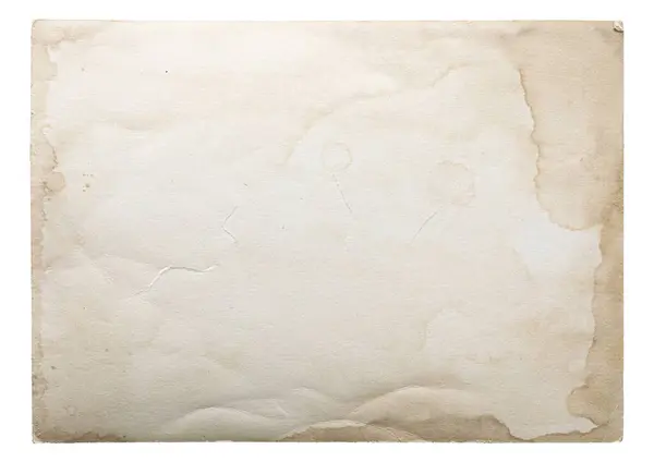 Görüntü, tarihi ya da antika kullanımını ima eden lekeli ve yırtık kenarlı yıpranmış eski bir kağıt parçasını gösteriyor..