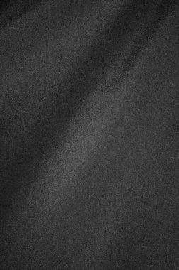 Yakından bakıldığında zarafeti artıran ince bir parıltıyla pürüzsüz siyah kumaş dokusu sergiler