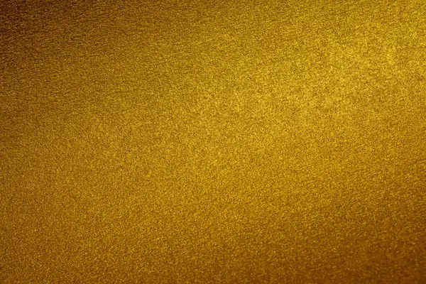 Işıldayan altın doku seçici odaklı zarif ve lüks bir arkaplan yaratıyor..