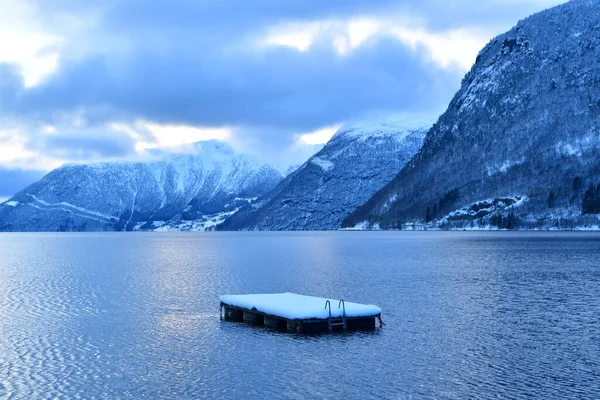 cold water freezing tough swimming plattform in winter norway fjord. High quality photo