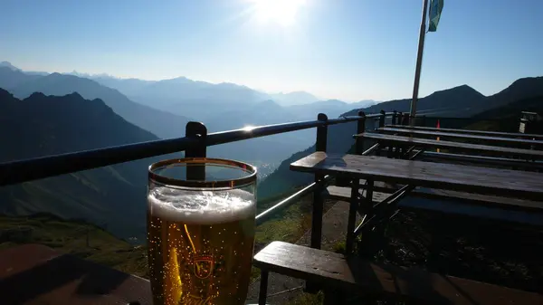 Beer on Mountain terrace alcohol alps skiing mountaineering. High quality photo