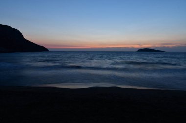 Kalymnos 'ta gün batımı Yunanistan' da uzun süre okyanus dalgaları oluşturur. Yüksek kalite fotoğraf