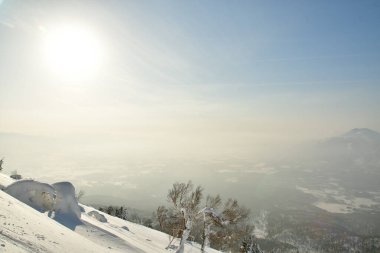 Mt Yotei steep ascent in Snow to top Views sun panorama Hokkaido Japan. High quality photo clipart