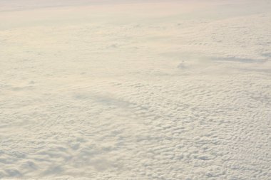 Carpet of clouds from above sky travel jet. High quality photo clipart