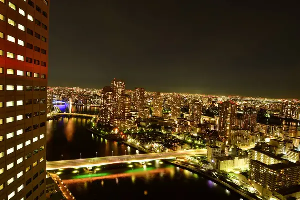 stock image Tokyo at night scityscape from skyscraper river bridges. High quality photo